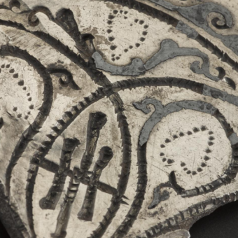 Decorated piece of broken silver