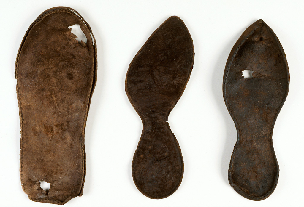 What appears to be brown soles of medieval shoes