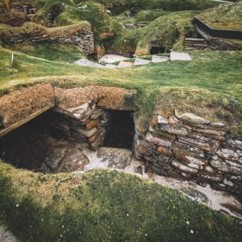 Excavated stone room with turf on top