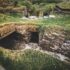 Excavated stone room with turf on top