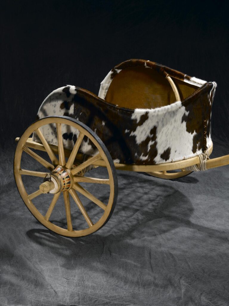 Reconstruction of a chariot, made from wood (mostly ash), rawhide, iron and feathers