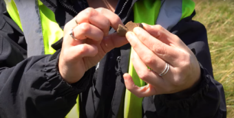 Photo of hands holding a small piece of pot