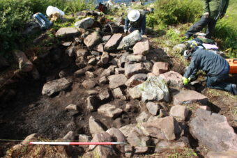 Excavations underway on the artificial islet settlement in Loch na Claise, with Historic Assynt