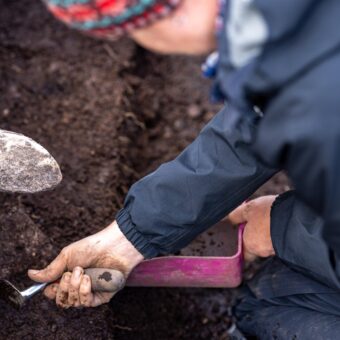 Person digging in a trench