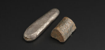 Early historic or viking cast silver ingot comprising an irregular tapered rod with rounded ends