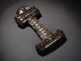 Viking sword hilt of bronze inlaid with silver,