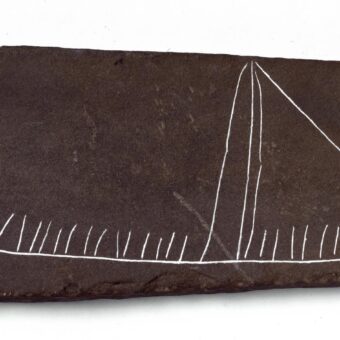Carving of a Viking ship on a slate