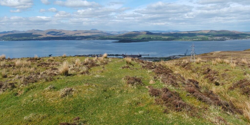 View over an estuary with grassy mounds in the foreground