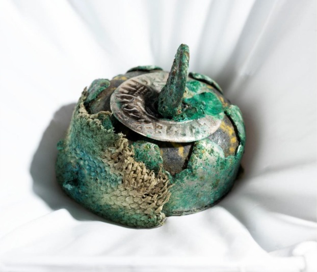 Mineral preserved textile on the metal casing of a composite glass bead pendant from the Galloway Hoard