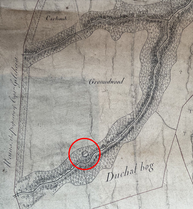 Section of a hand-drawn plan showing a castle and a tree line