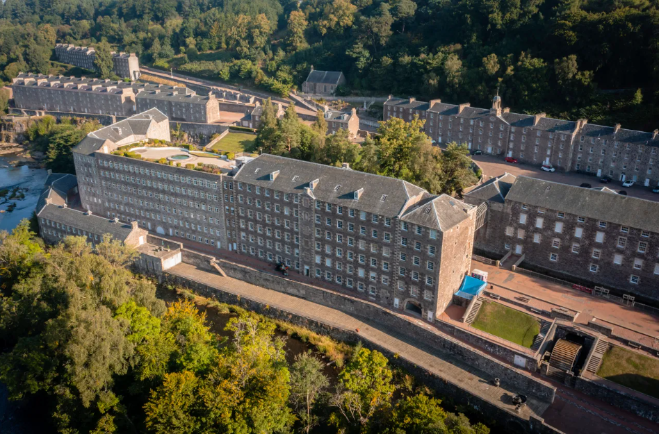 Photo of a large early industrial mill site on the site of a river