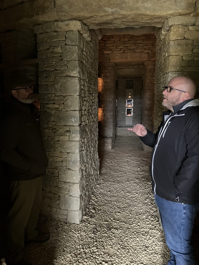 Person conducts an interview in a barrow built in 2019 that is used to store cremated remains 