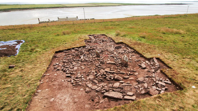 Photo of an archaeological trench by the sea