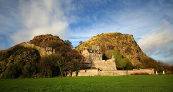 Photo of a modern military barracks built into the side of volcanic rock