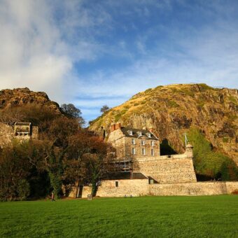 Photo of a modern military barracks built into the side of volcanic rock