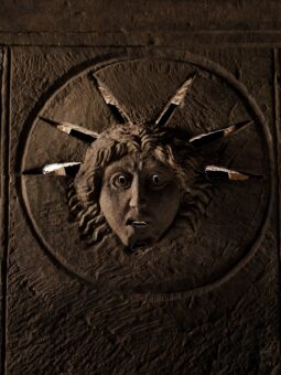 Image of a Roman altar: One depicts the face of the sun god Sol and would have been illuminated from behind so that in the low light of the temple, worshippers would have seen his eyes, mouth and the rays of his solar crown glowing.
