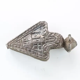 A decorative silver object