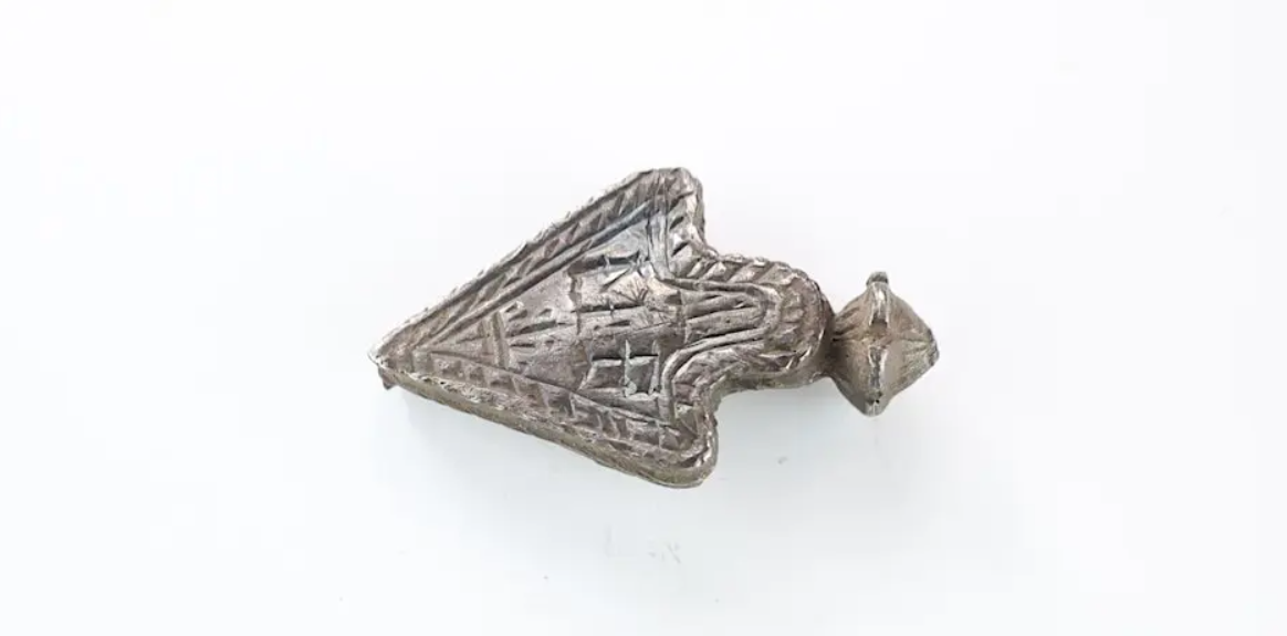 A decorative silver object