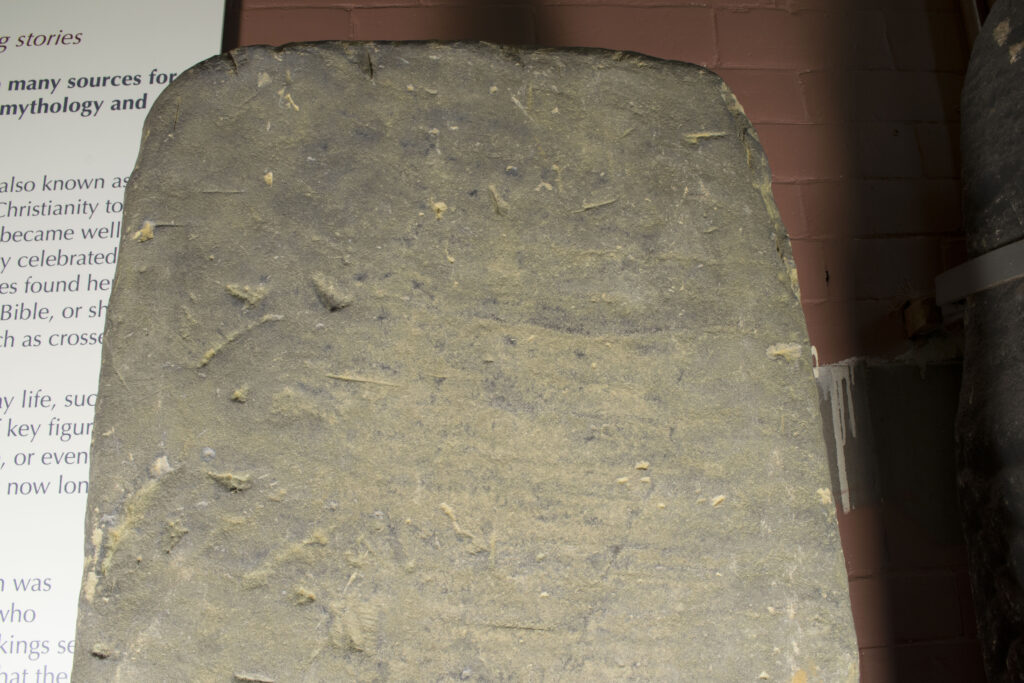 The very eroded surface of Govan 31 which still retains areas of 10th-11th century carving.