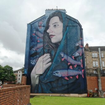 Mural depicting St Thenue (mother of St Mungo) surrounded by fish