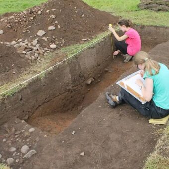 Two people in a trench