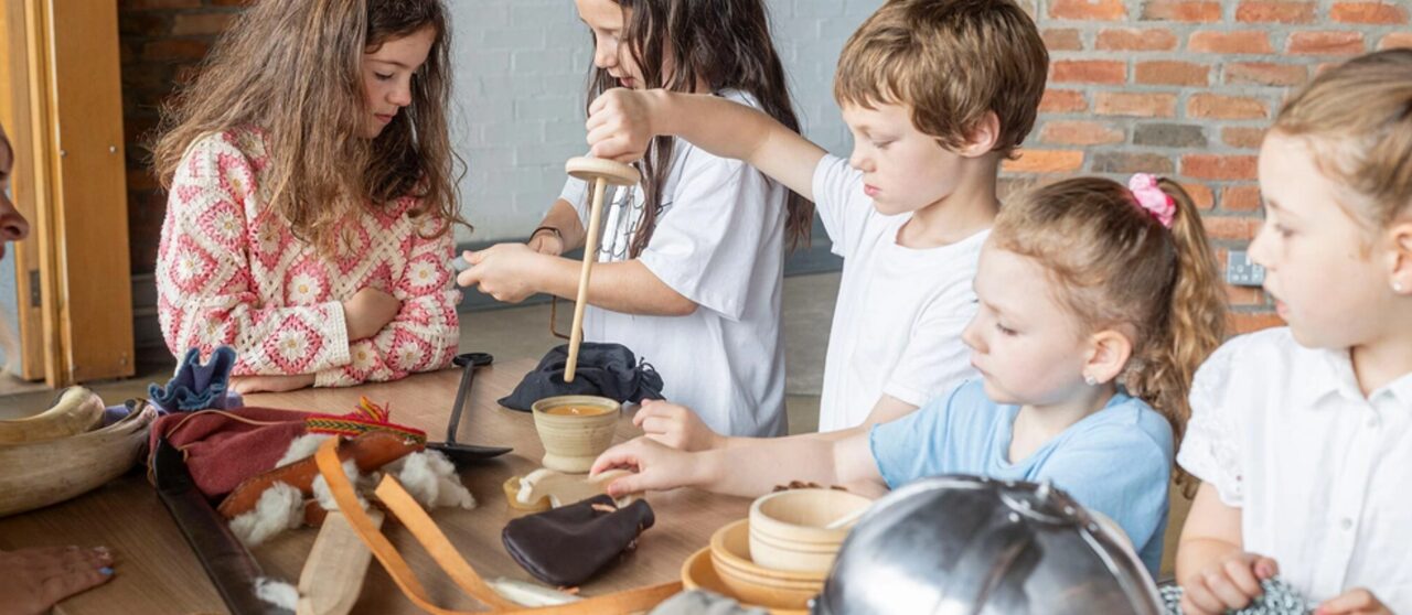 Photo of children playing with tools and toys