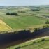 Aerial photo of a river with fields on either side