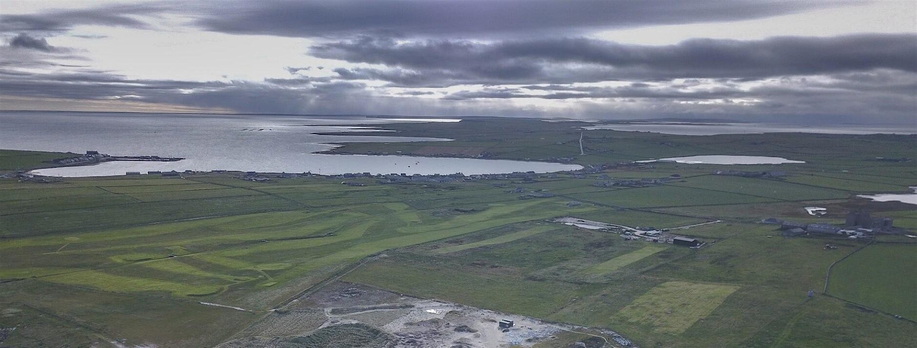 Aerial view of a rural, coastal landscape