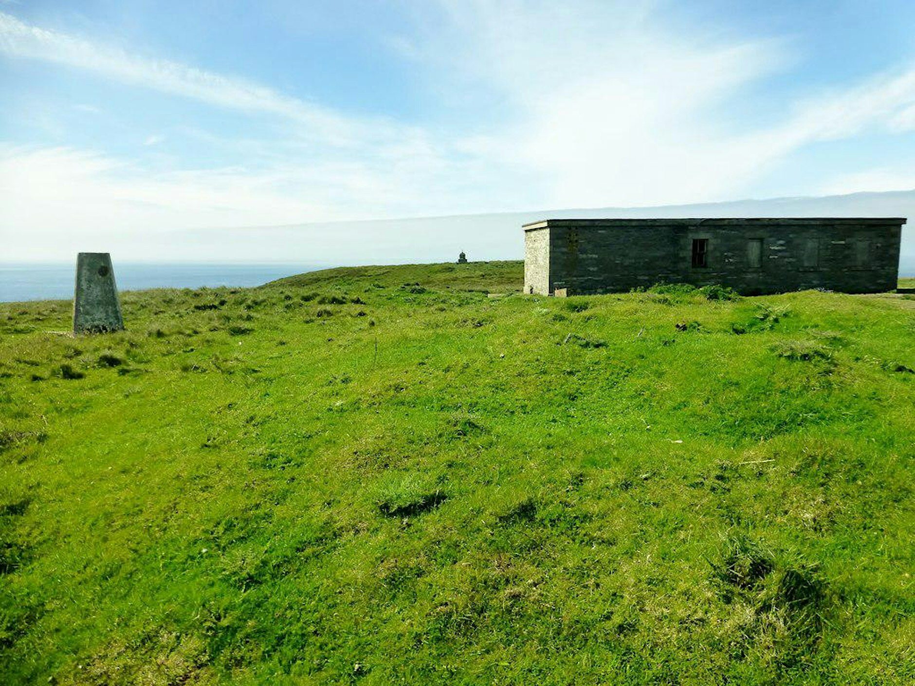 Historic structures in a grassy landscape
